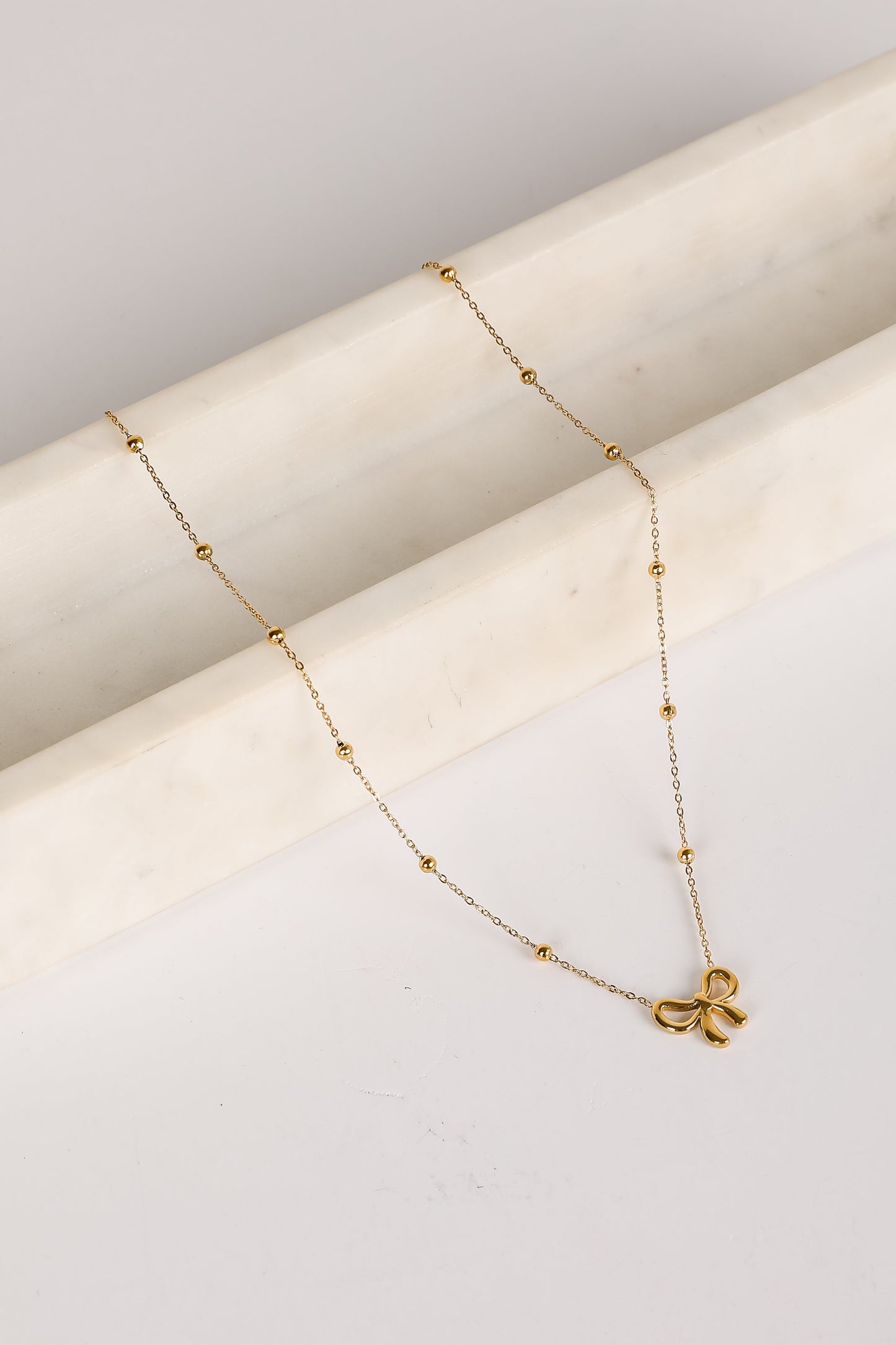 Elizabeth Gold Bow Charm Necklace