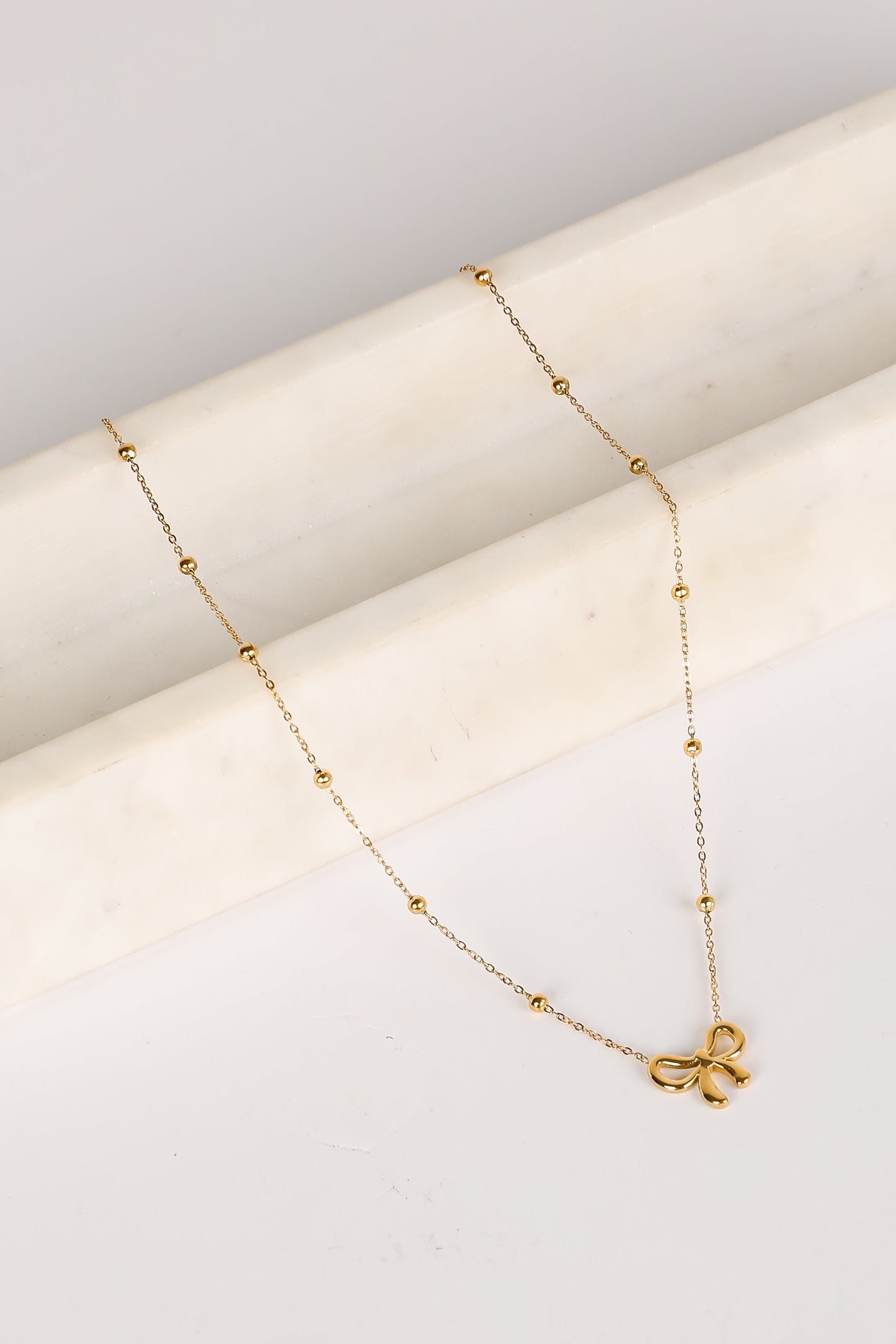 Elizabeth Gold Bow Charm Necklace