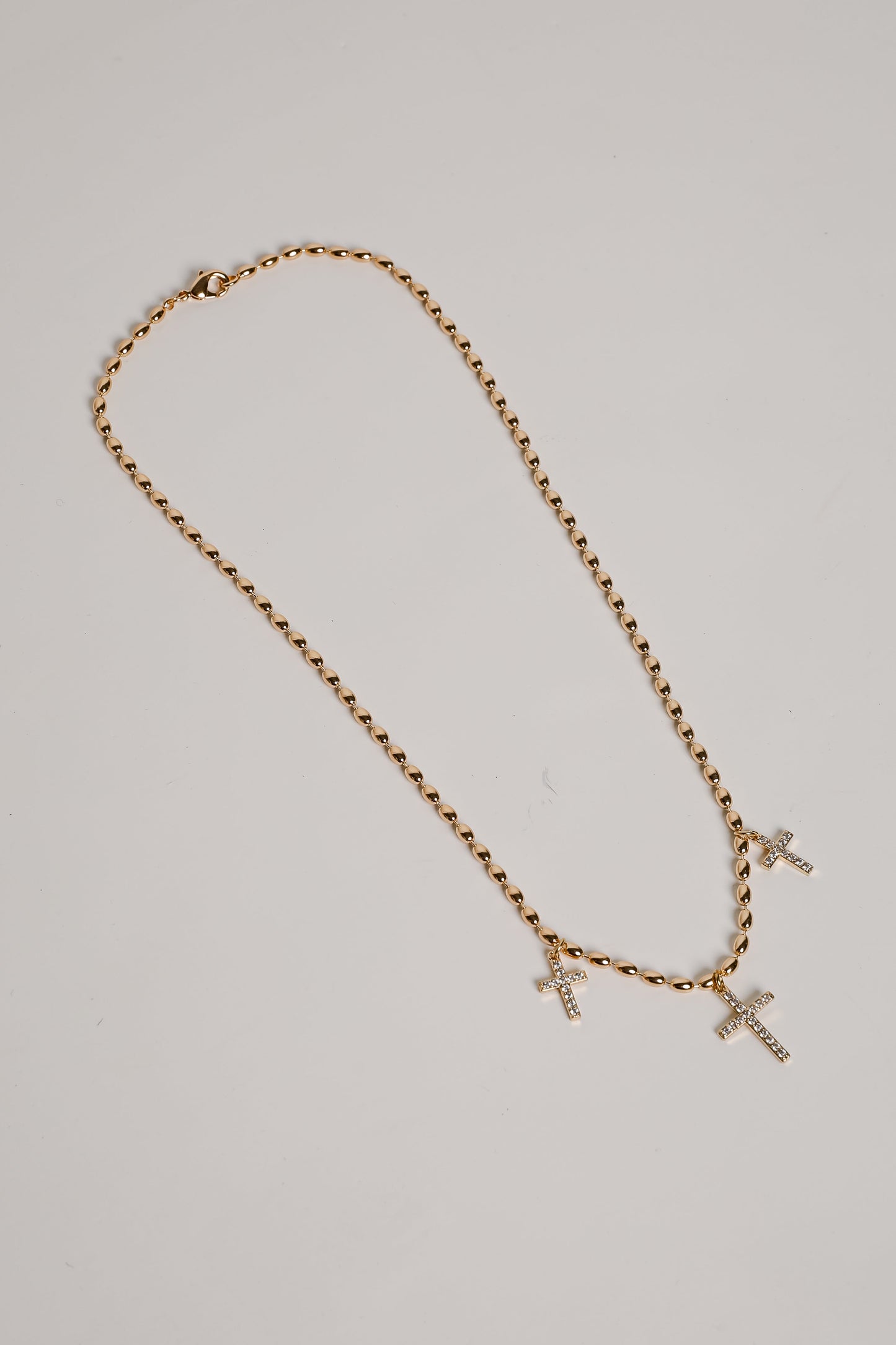 Naomi Gold Cross Charm Necklace