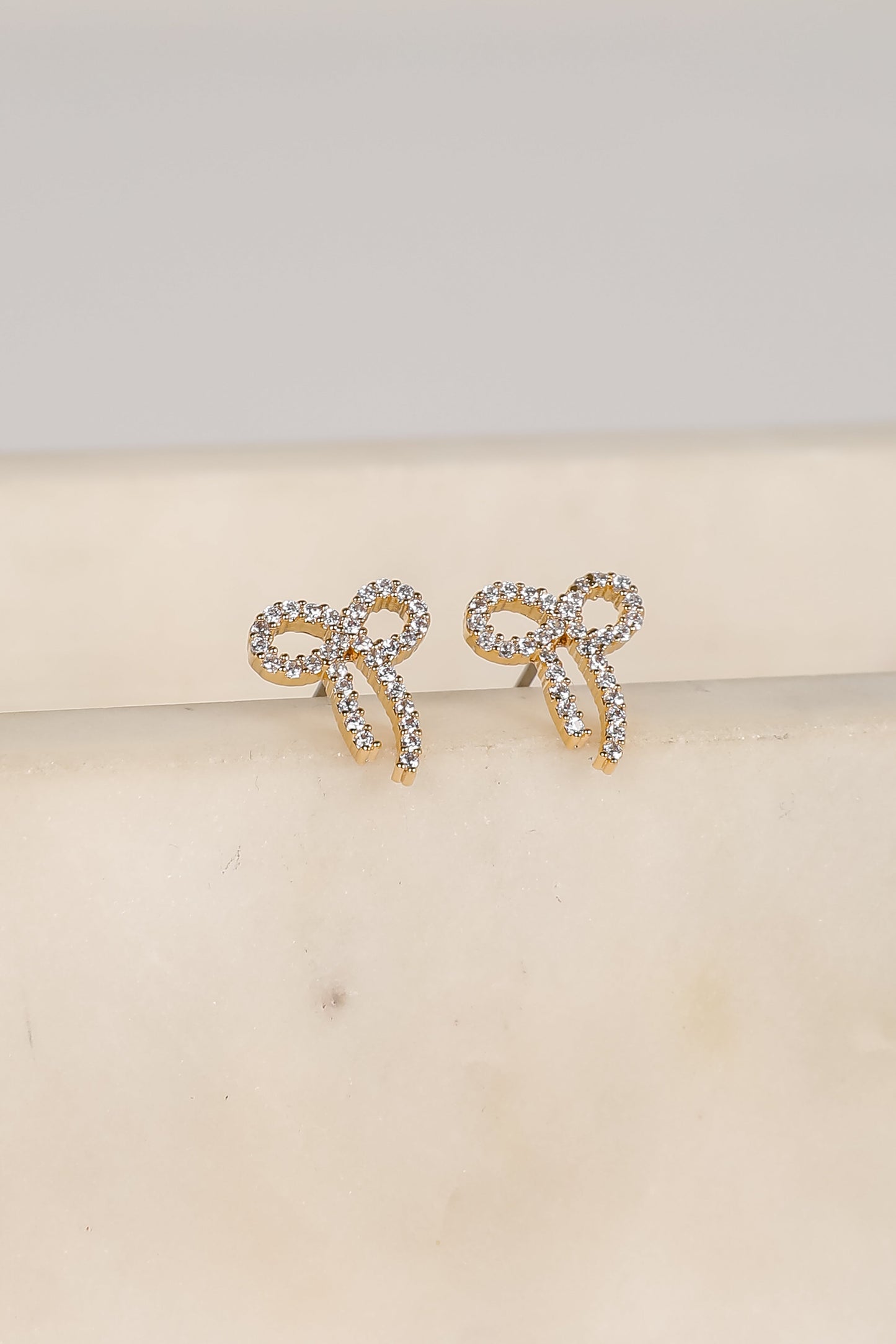 Daniella Gold Rhinestone Bow Earrings
