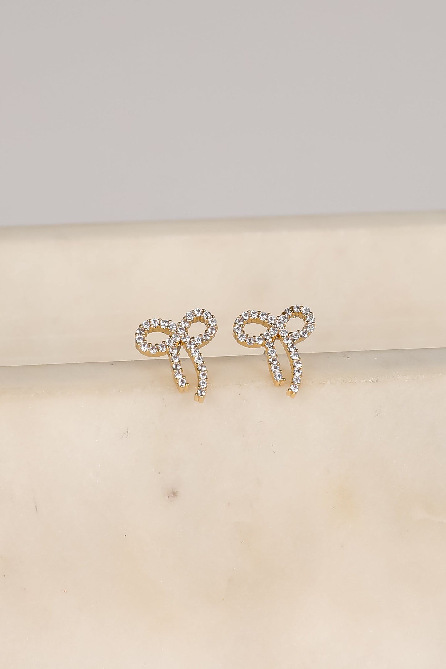 Daniella Gold Rhinestone Bow Earrings